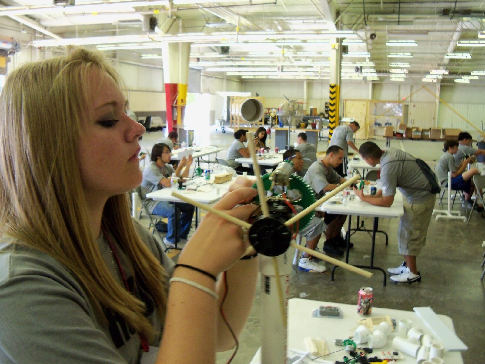 Student assembling a model wind turbine at the Run on the Wind summer camp
