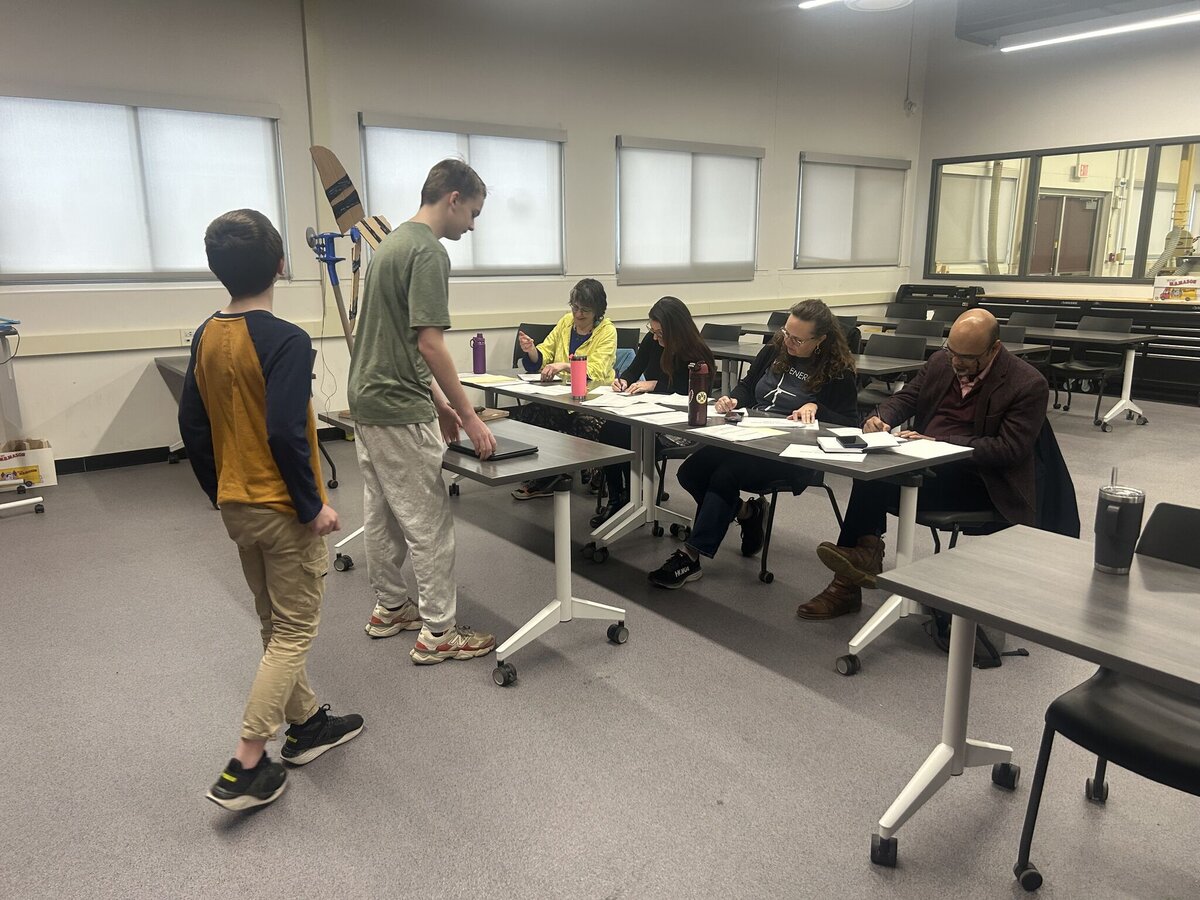 Students presenting their design to the judging panel at the Capital District Wind Challenge